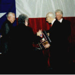 Joan Drennan-Taylor, Texas Science Summit Director, 2001 Hall of Fame member Melvin Schroeder, and Robert Ramsay, present Michel T. Halbouty his award
